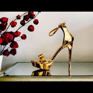 Shiny gold stiletto heels